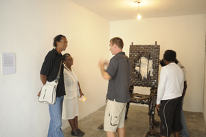 Exhibition at L'Artocarpe. Artist explaining his work to members of the public (2009)