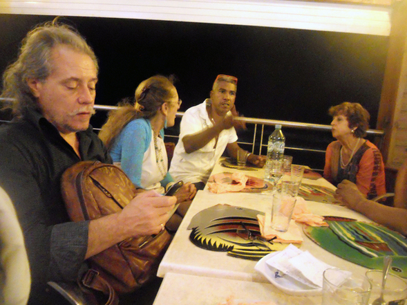 The discussion among artists, art critics and the director is continuing at the restaurant