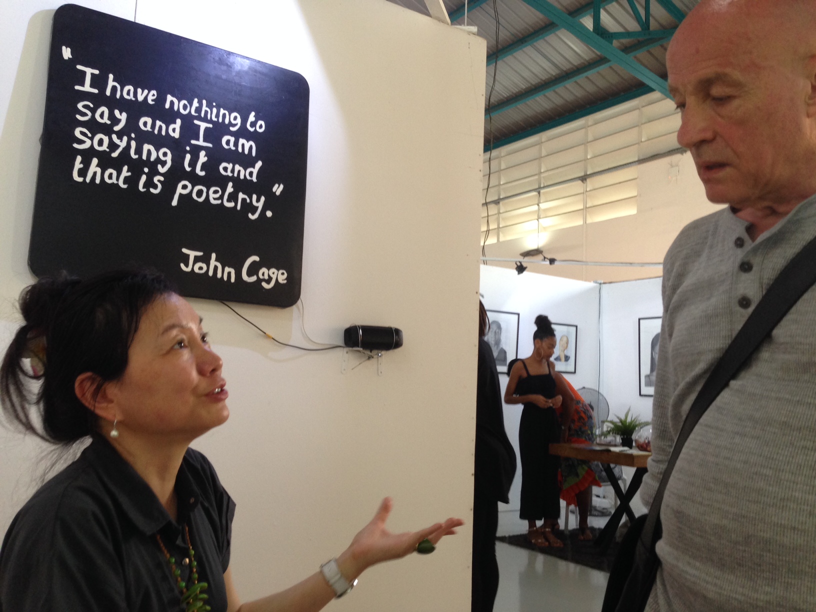 Curator Louise Tsai and André Rouillé in conversation in Joëlle Ferly's space at PooL Art Fair
