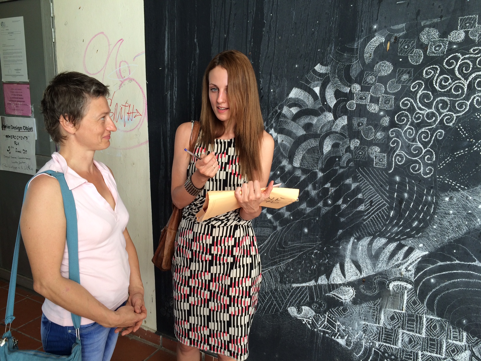 Lana Kustova (right) talking with a student at the art school of Martinique, Jan. 2016.